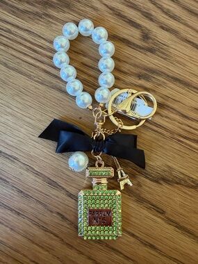 Green Crystal Perfume Bottle Keychain with Pearl Bracelet and Black Bow